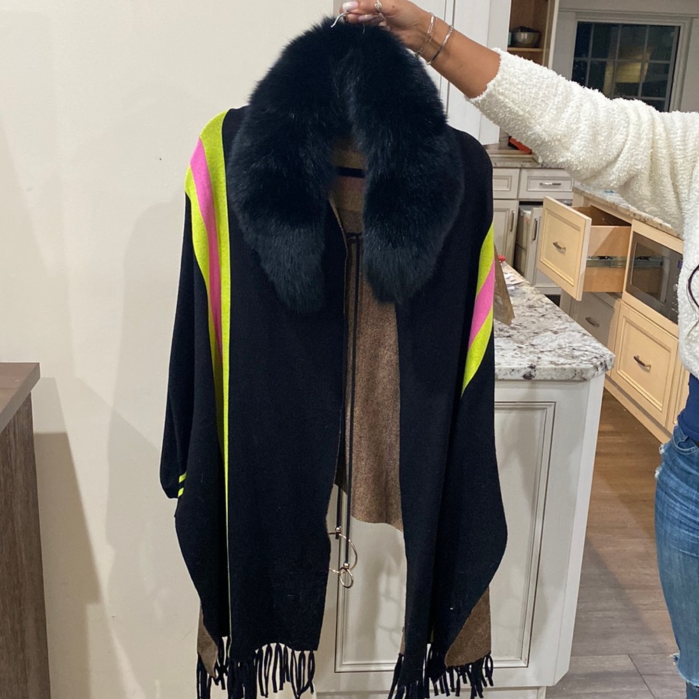 Black poncho hot pink and yellow detailing removable fur collar fringe bottom